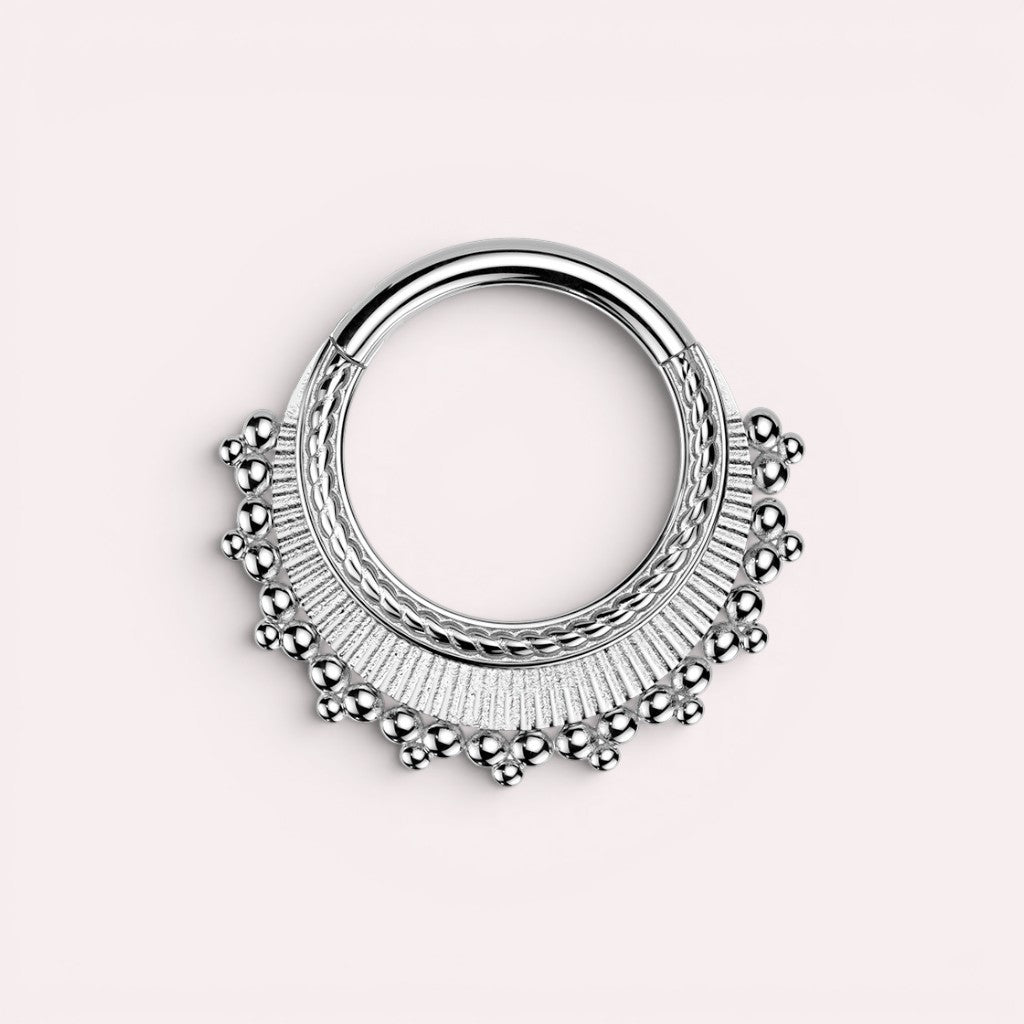 MKBodyJewelry 16g silver beaded tribal style septum clicker ring made of surgical steel. Hinged closure.