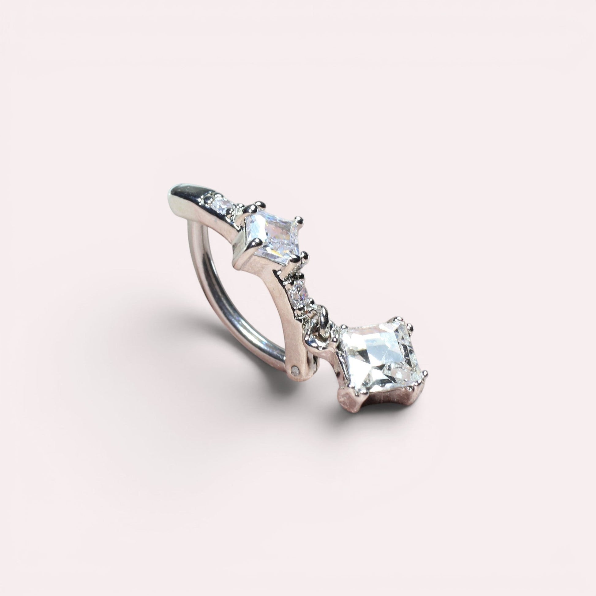 MKBodyJewelry 14g silver surgical steel belly button ring with sparkling CZ stones and a dangling charm.