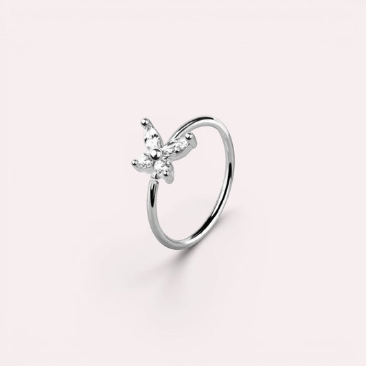 MKBodyJewelry 20g silver surgical steel nose hoop featuring a dainty butterfly charm with clear CZ stones.