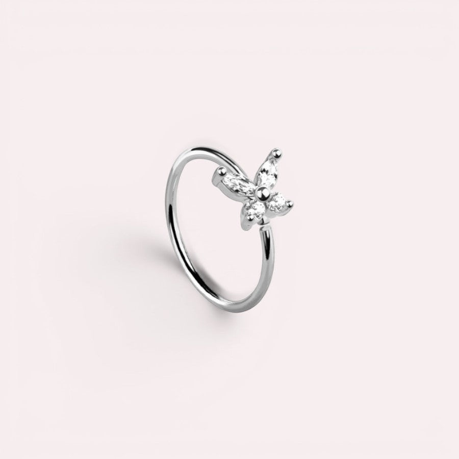 MKBodyJewelry 20g silver surgical steel nose hoop featuring a dainty butterfly charm with clear CZ stones.