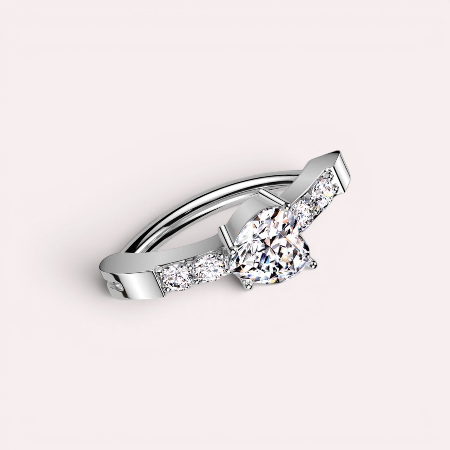 MKBodyJewelry 14G silver surgical steel belly clicker ring featuring a heart-shaped CZ stone and sparkling accents.