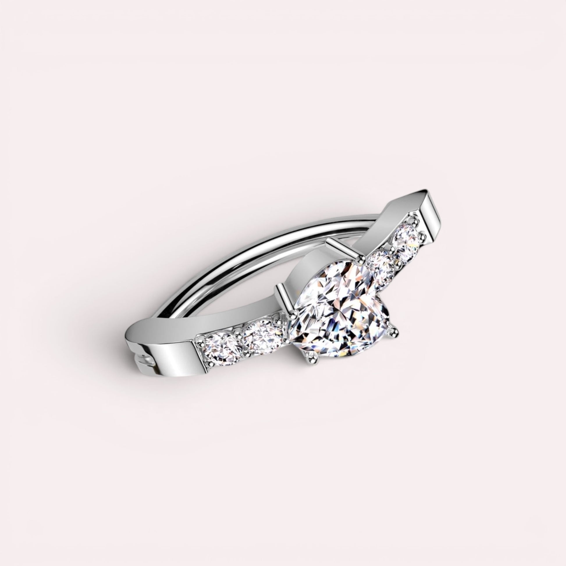 MKBodyJewelry 14G silver surgical steel belly clicker ring featuring a heart-shaped CZ stone and sparkling accents.
