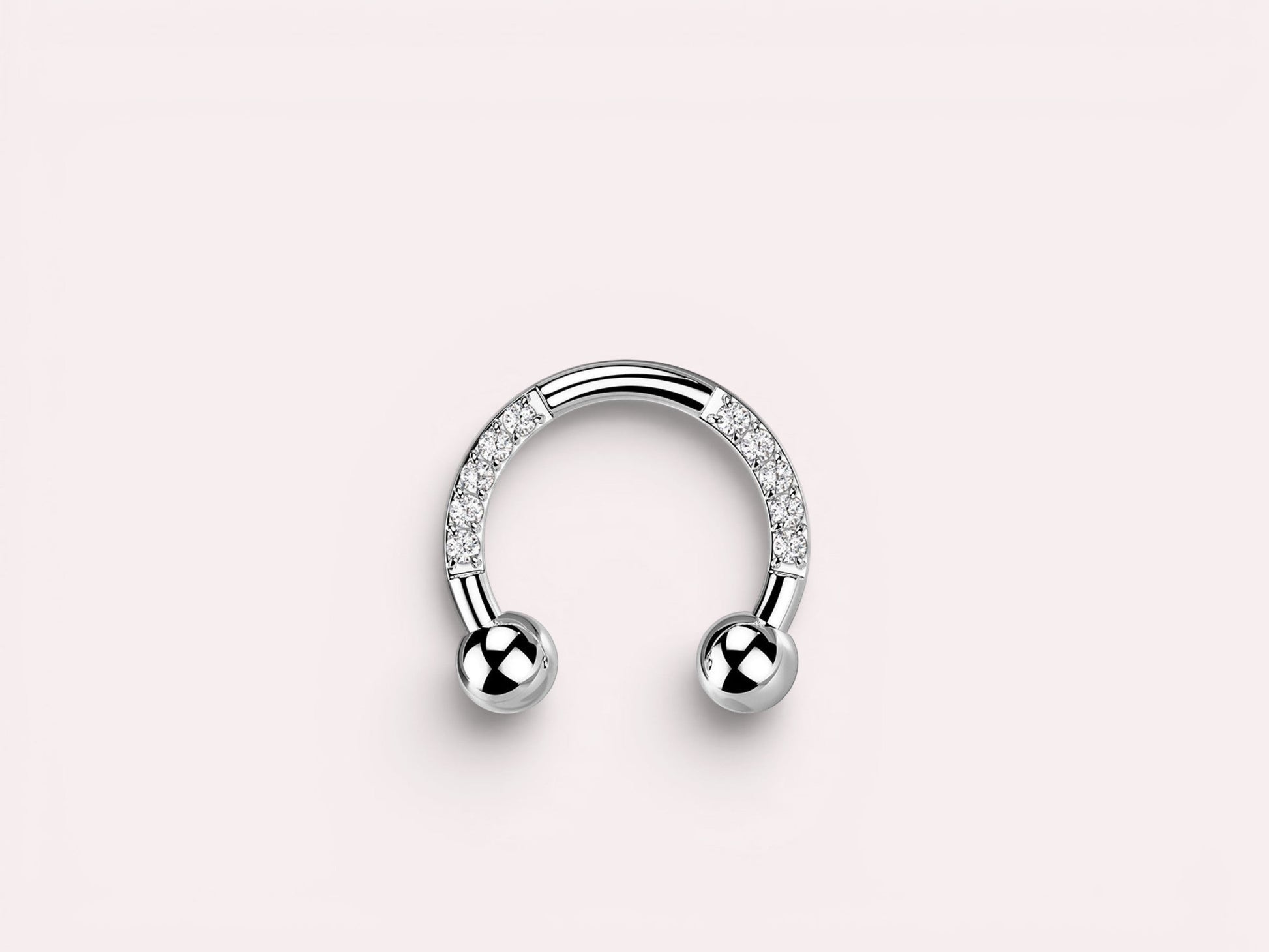 MKBodyJewelry silver horseshoe earring with pave CZ sides and ball ends, made of implant grade titanium.
