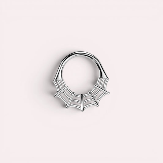 MKBodyJewelry silver surgical steel 16g spider web septum clicker ring with hinged segment hoop design.