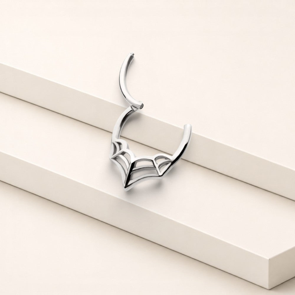 MKBodyJewelry 16G silver surgical steel spider web septum clicker ring with a hinged segment for easy wear.
