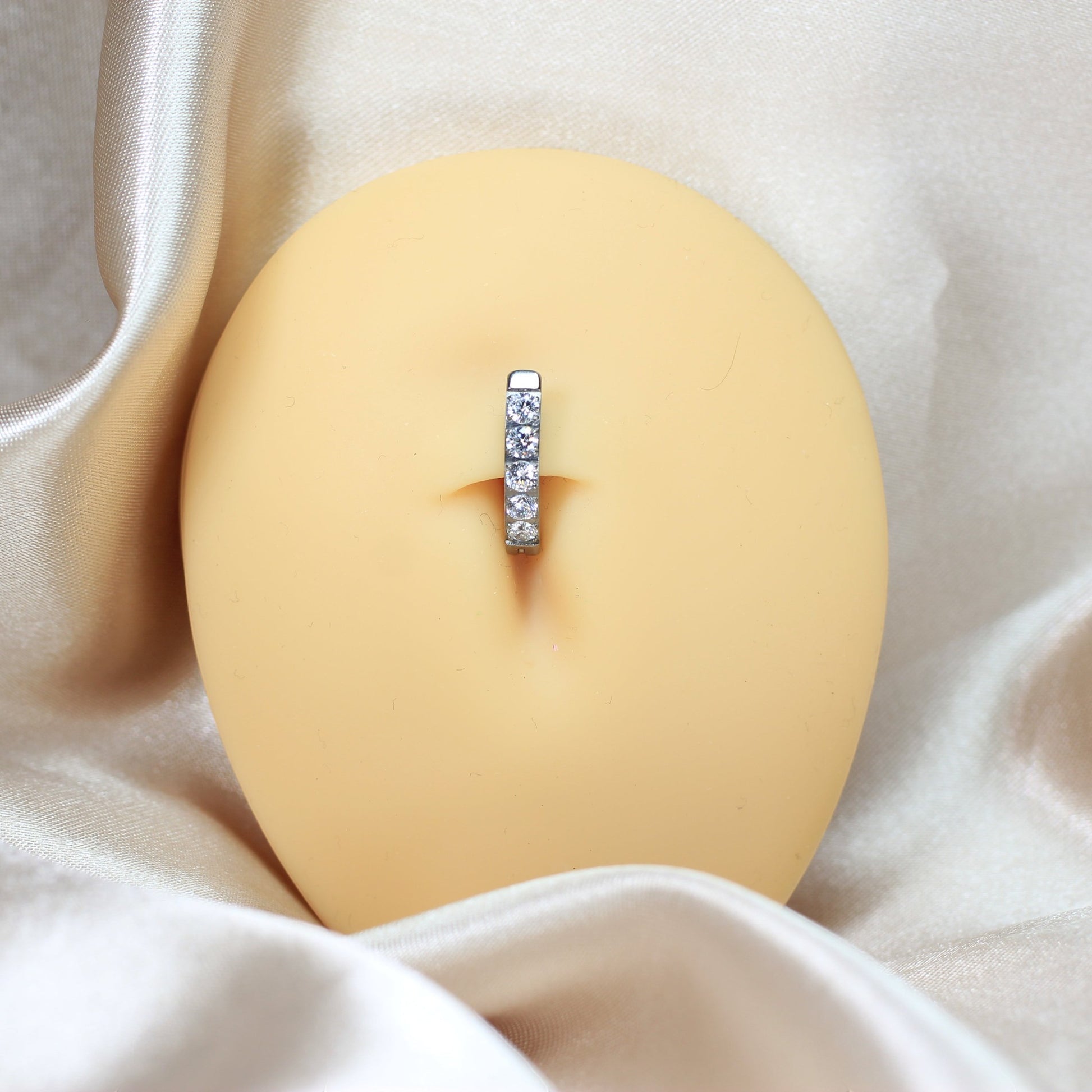 MKBodyJewelry minimalist silver gem titanium belly clicker ring, 14g, 10mm barbell. Lightweight and tarnish-resistant.
