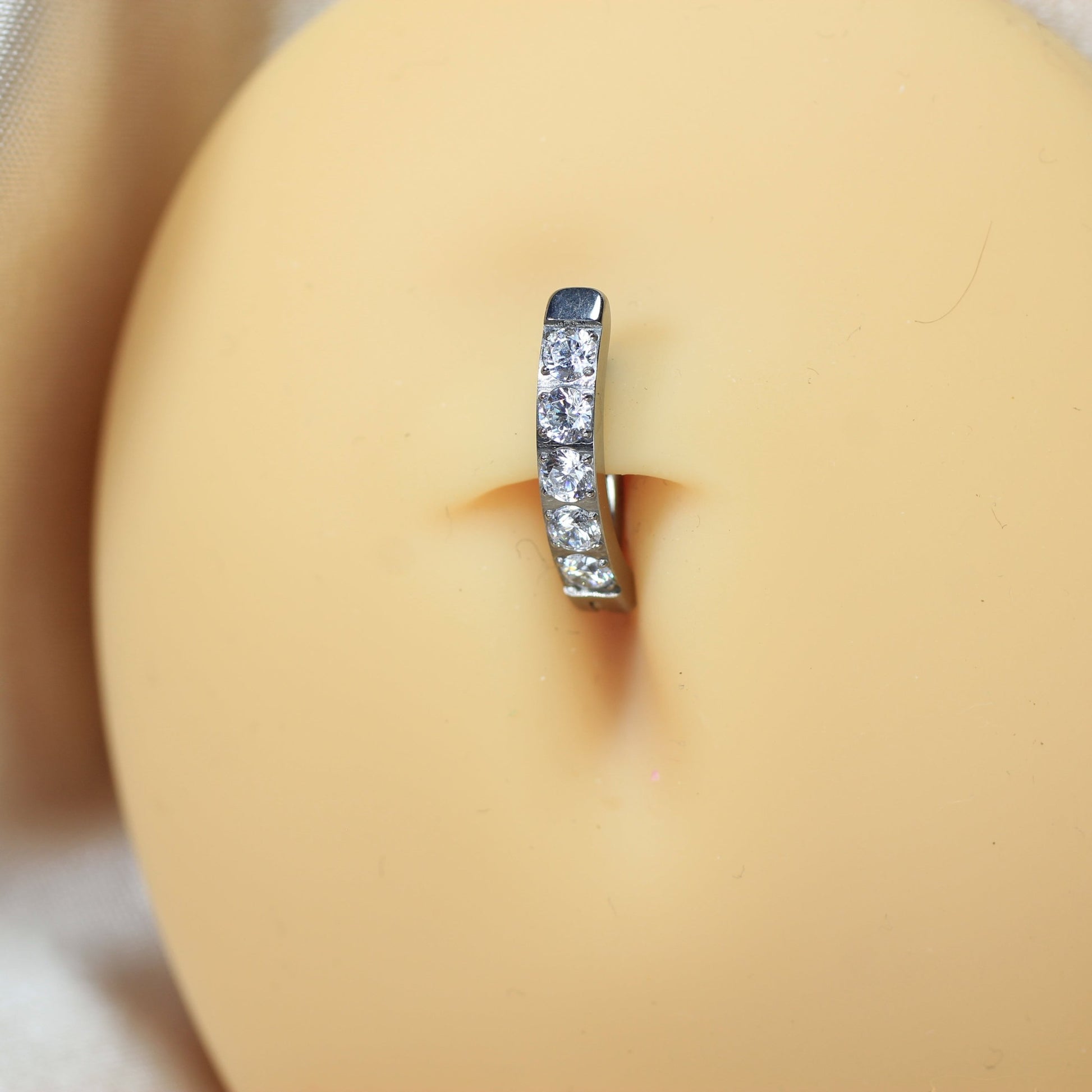 MKBodyJewelry minimalist silver titanium belly clicker ring with clear gems. 14g, 10mm barbell length.