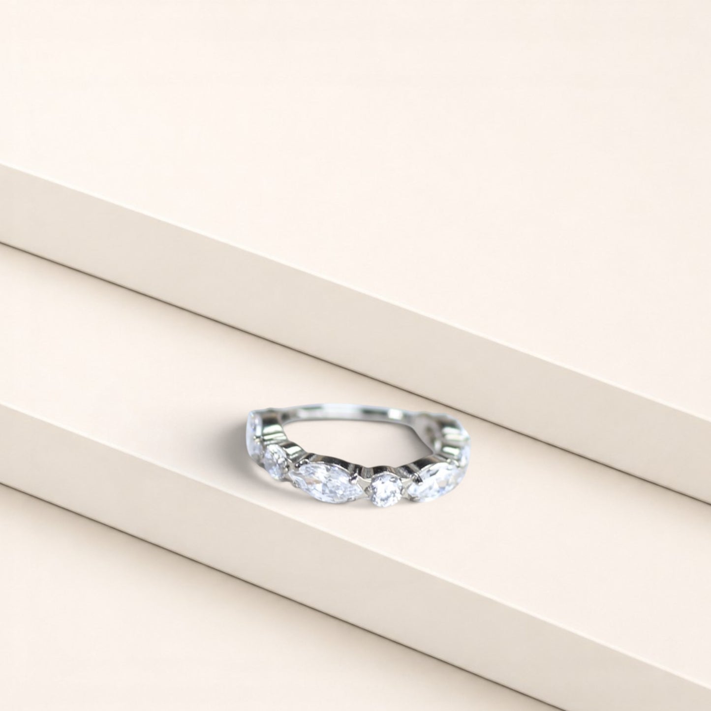 MKBodyJewelry silver titanium nose clicker ring with marquise and round CZ gems for a minimalist snug fit.