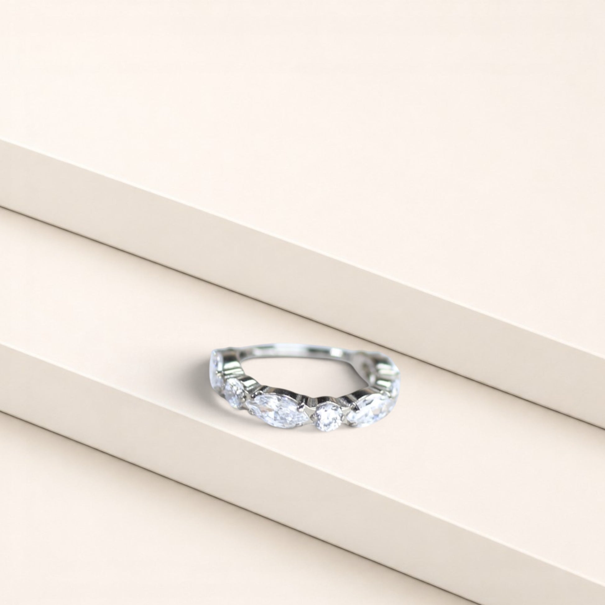 MKBodyJewelry silver titanium nose clicker ring with marquise and round CZ gems for a minimalist snug fit.