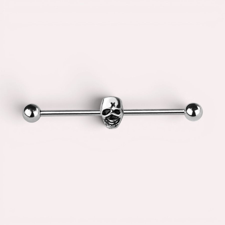 MKBodyJewelry 14G surgical steel industrial barbell featuring a silver skull charm for cartilage piercings.