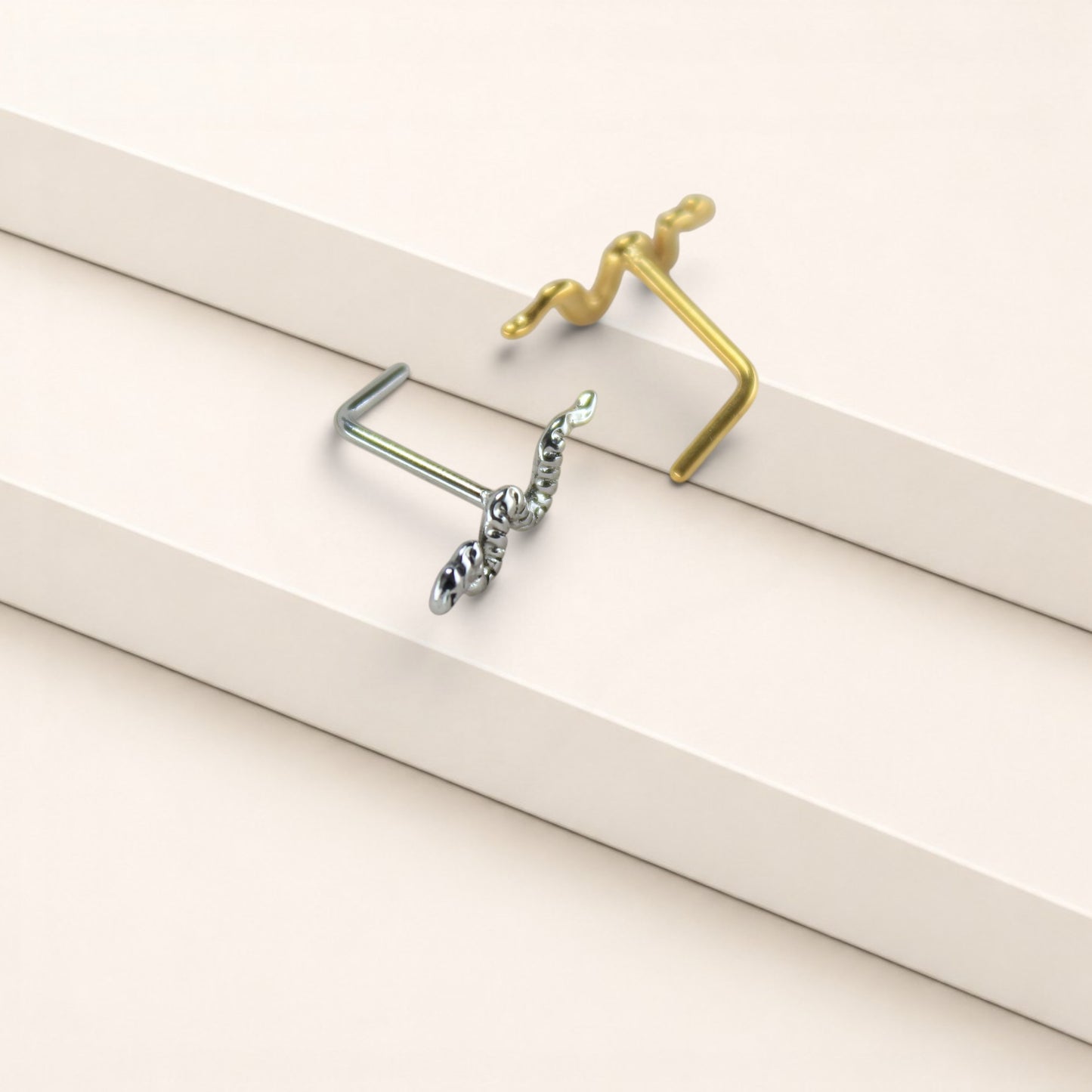 MKBodyJewelry 20g surgical steel snake nose studs in gold and silver with L-bend posts for secure everyday wear.
