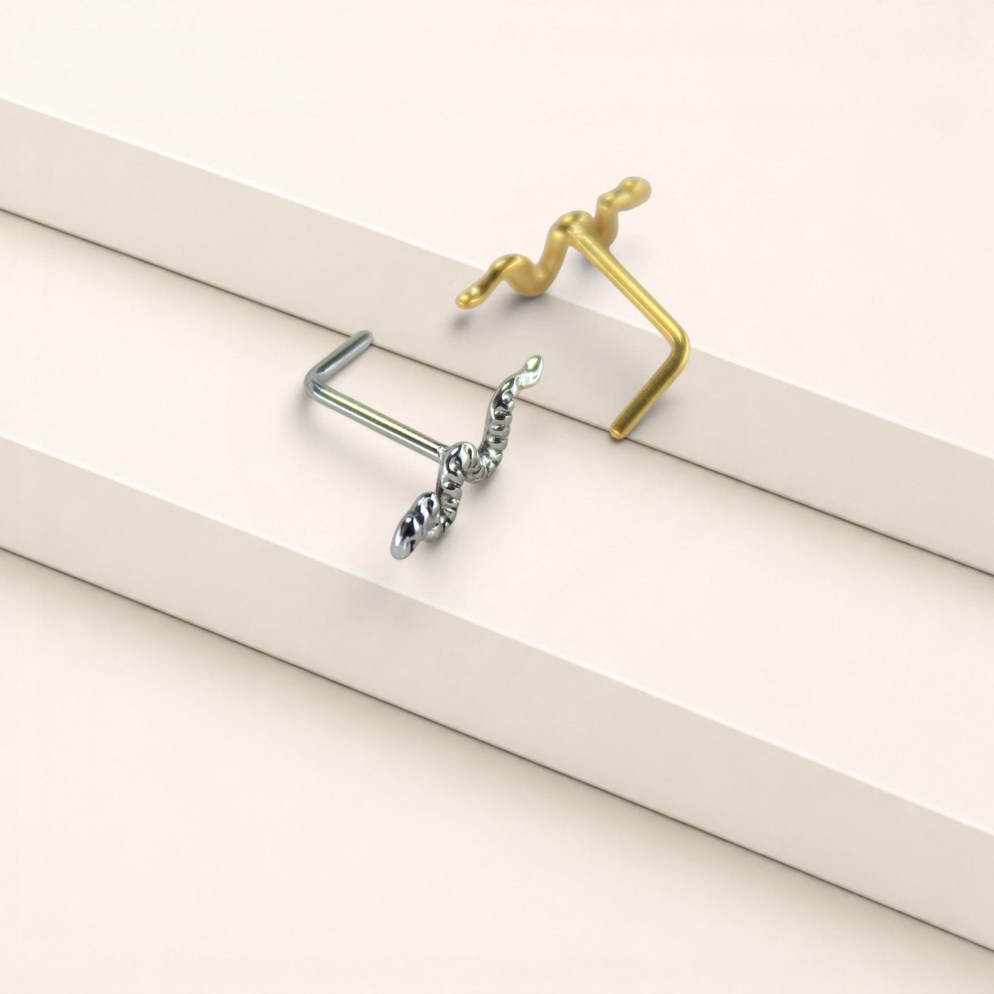 MKBodyJewelry 20g surgical steel snake nose studs in gold and silver with L-bend posts for secure everyday wear.