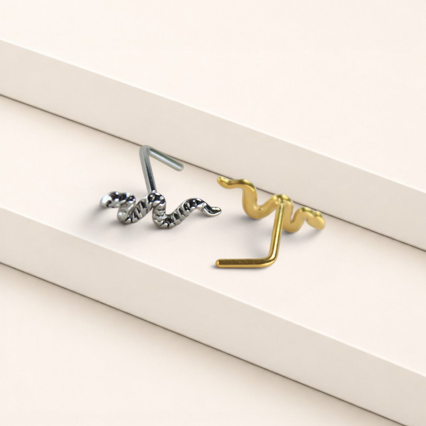 MKBodyJewelry 20g snake nose studs in gold and silver surgical steel with L-bend posts for secure everyday wear.