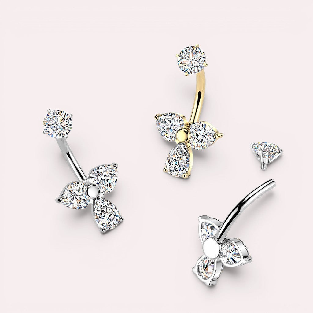 MKBodyJewelry sparkling floral belly button ring with cubic zirconia in gold-tone and silver-tone surgical stainless steel.