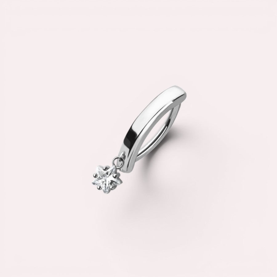 MKBodyJewelry silver-tone surgical steel belly button ring with a minimalist dangling star charm.