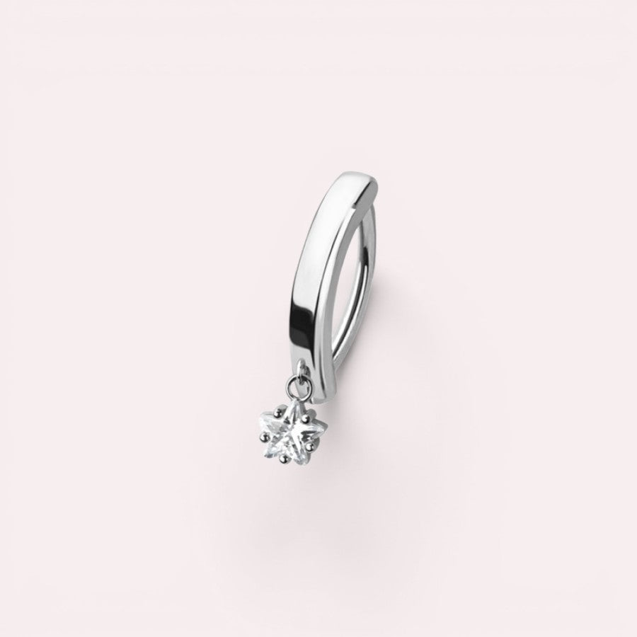 MKBodyJewelry silver-tone surgical steel clicker belly button ring with a dangling minimalist star charm.