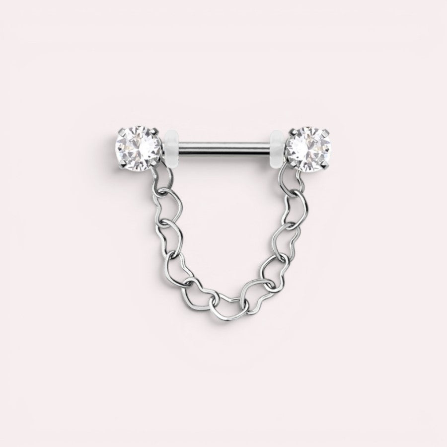 MKBodyJewelry 14g surgical steel nipple barbell with dangling heart chain and clear CZ prong ends. Sold as a pair.