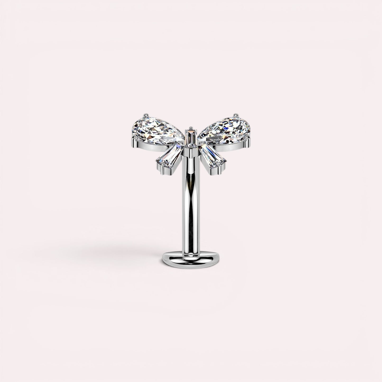 MKBodyJewelry dainty titanium threadless push in belly ring with bow design featuring clear pear and baguette cut cubic zirconia stones.