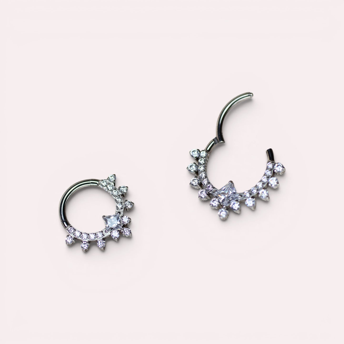 MKBodyJewelry silver titanium septum clicker ring featuring sparkling CZ crystals in a delicate sunburst design.