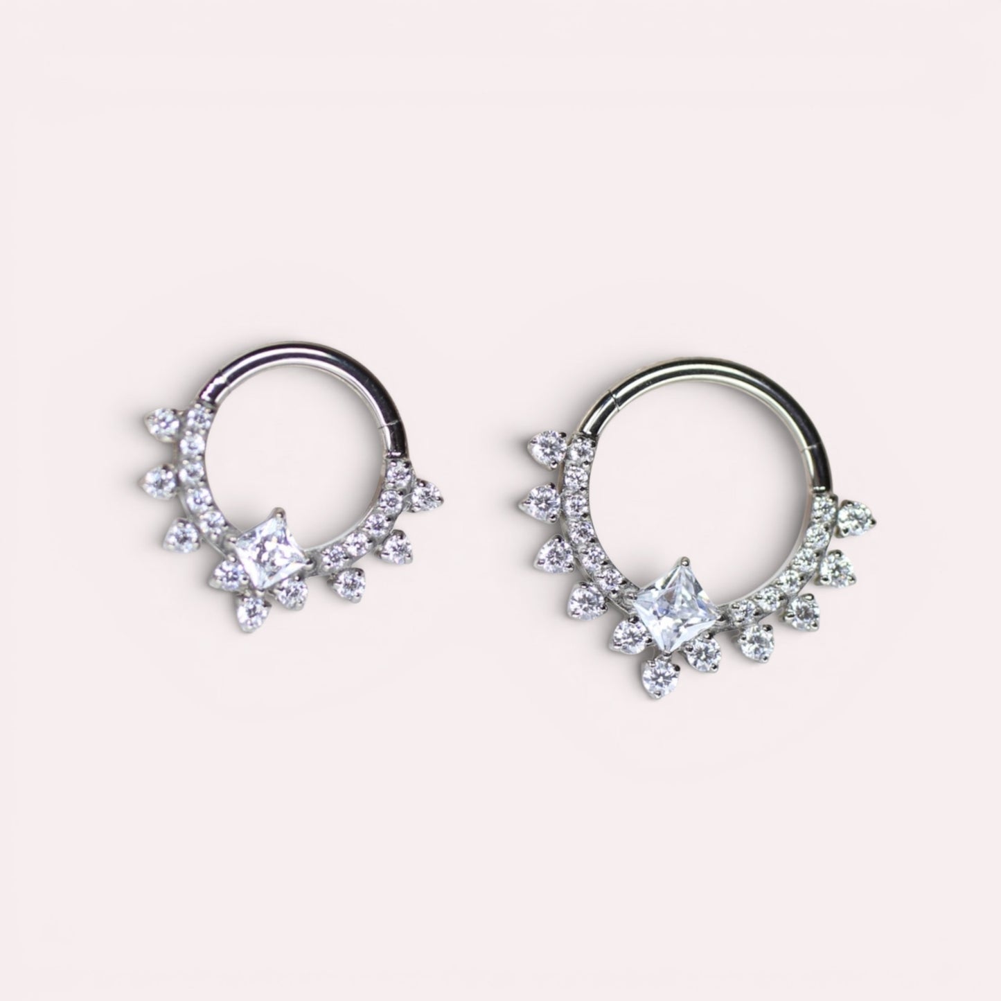 MKBodyJewelry 16g implant grade titanium septum clicker ring with sparkling CZ crystals in two sizes.