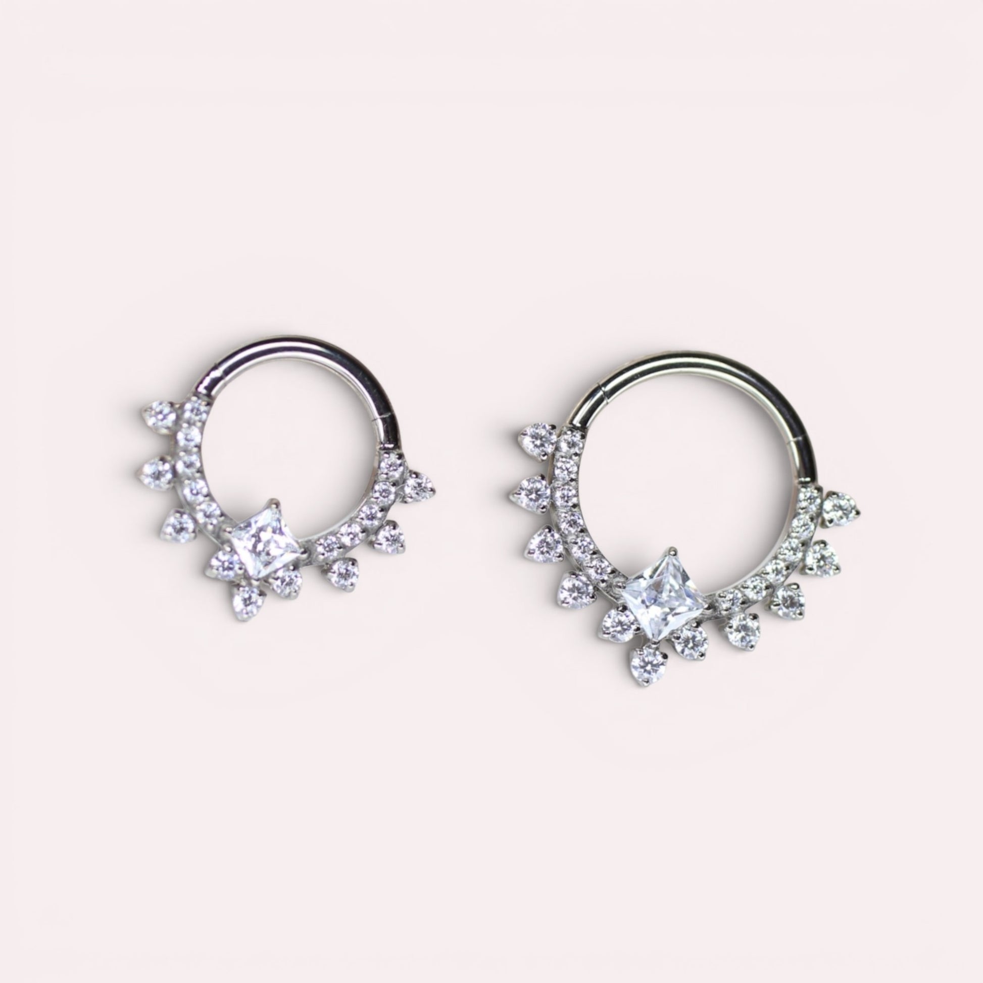 MKBodyJewelry 16g implant grade titanium septum clicker ring with sparkling CZ crystals in two sizes.