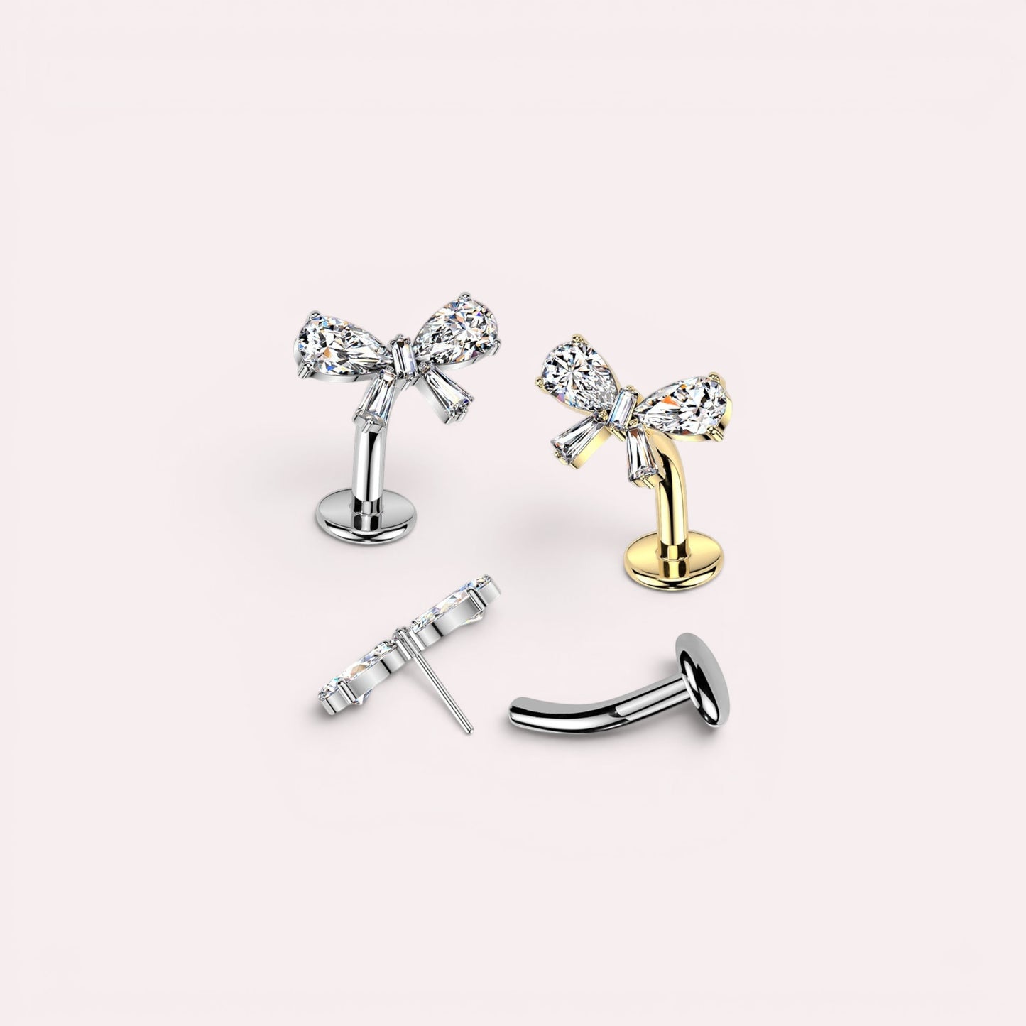 MKBodyJewelry dainty titanium gold bow belly ring with clear crystals. Threadless push-in design, 14G.