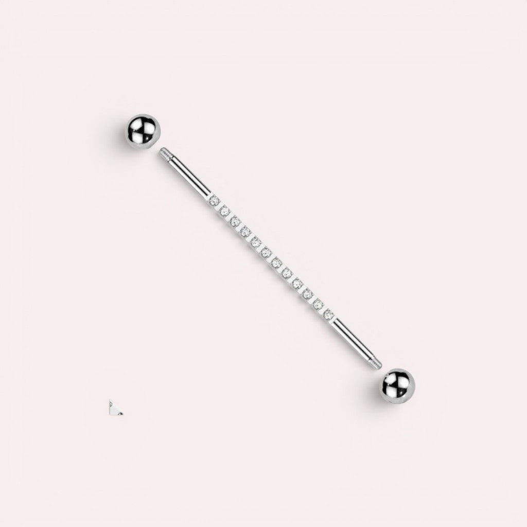 MKBodyJewelry 14G titanium industrial barbell with sparkling CZ stones and silver balls. Externally threaded closure.