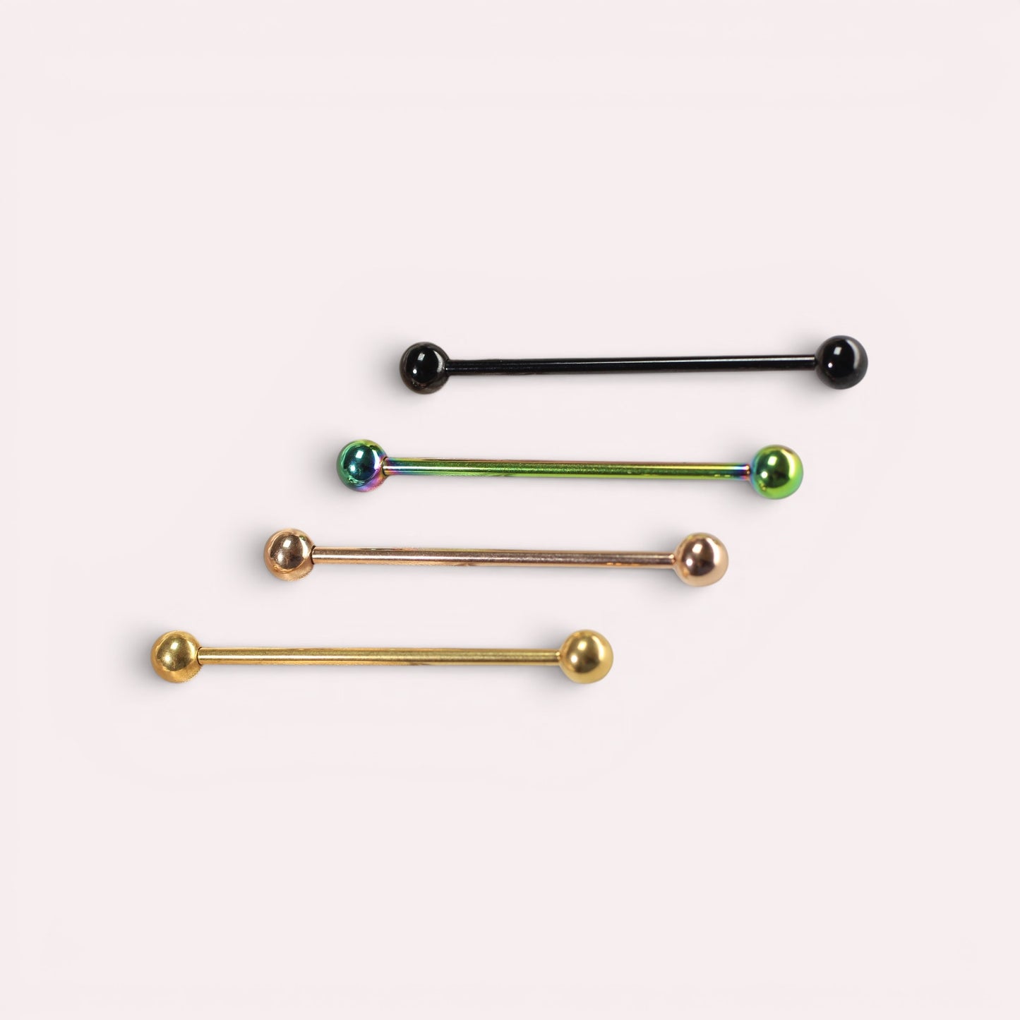 MKBodyJewelry 14G titanium industrial barbell piercings in black, iridescent, rose gold, and gold finishes.