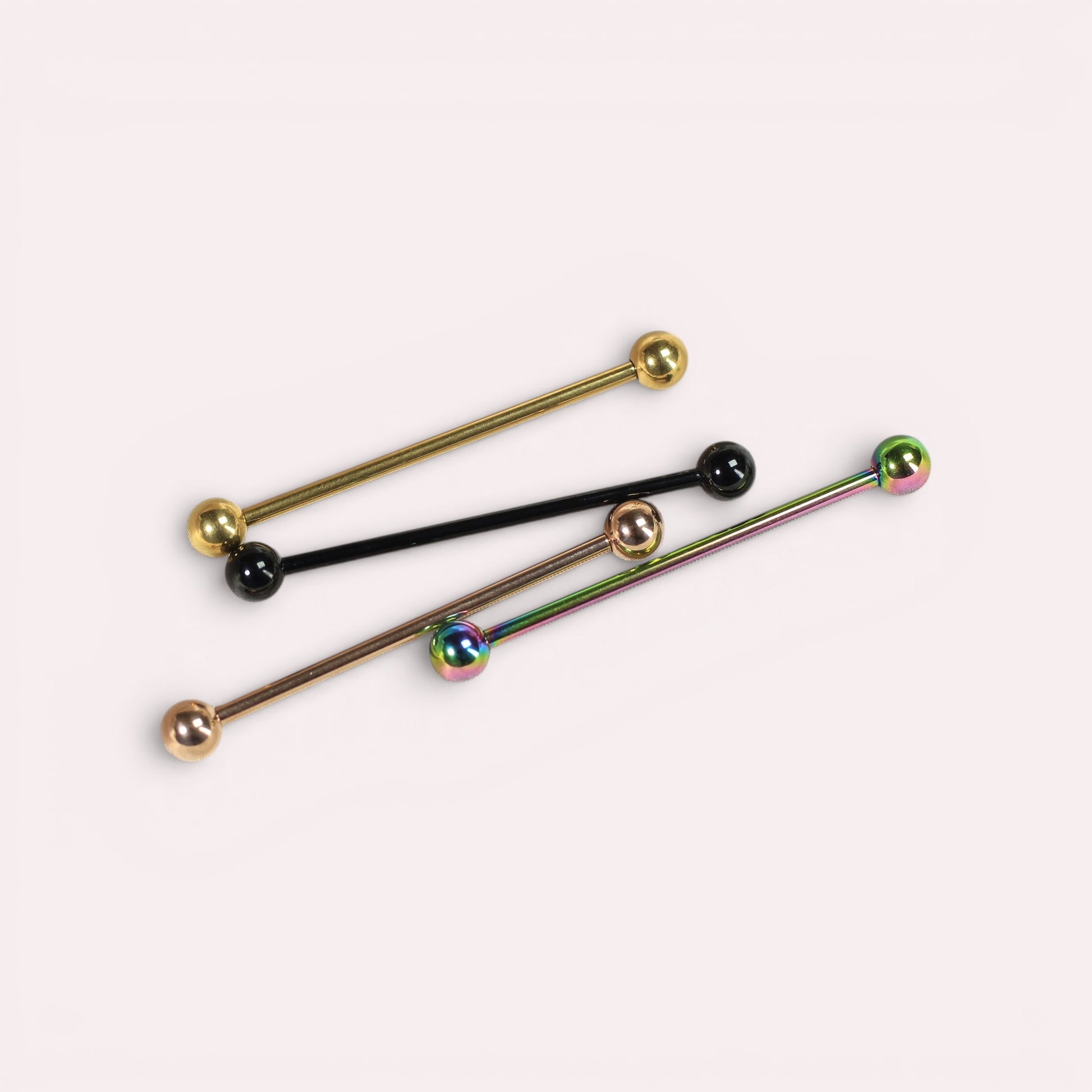 MKBodyJewelry 14G titanium industrial barbells in gold, black, rose gold, and iridescent finishes for cartilage.