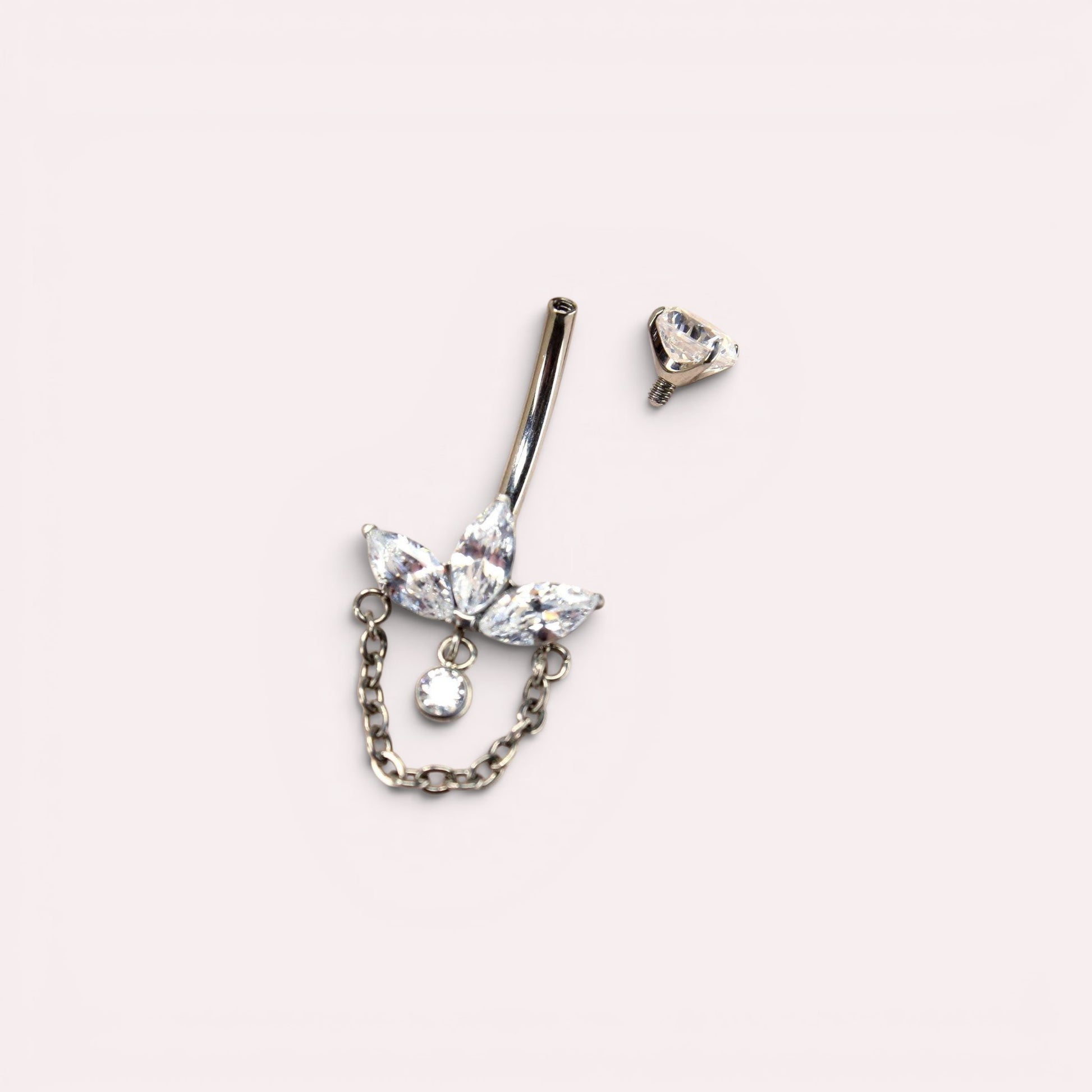 MKBodyJewelry 14g titanium belly button ring with a floral lotus design, marquise gems, and a delicate dangling chain.