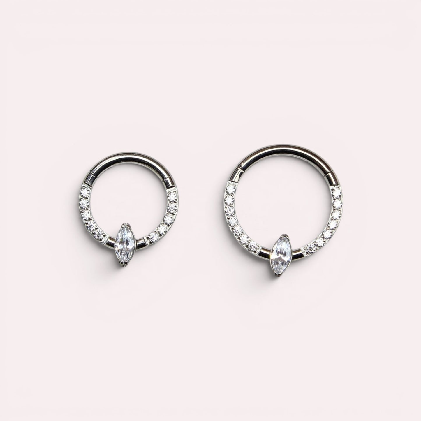 MKBodyJewelry titanium septum clicker rings with marquise and round clear gems in silver tone hinged hoop design.