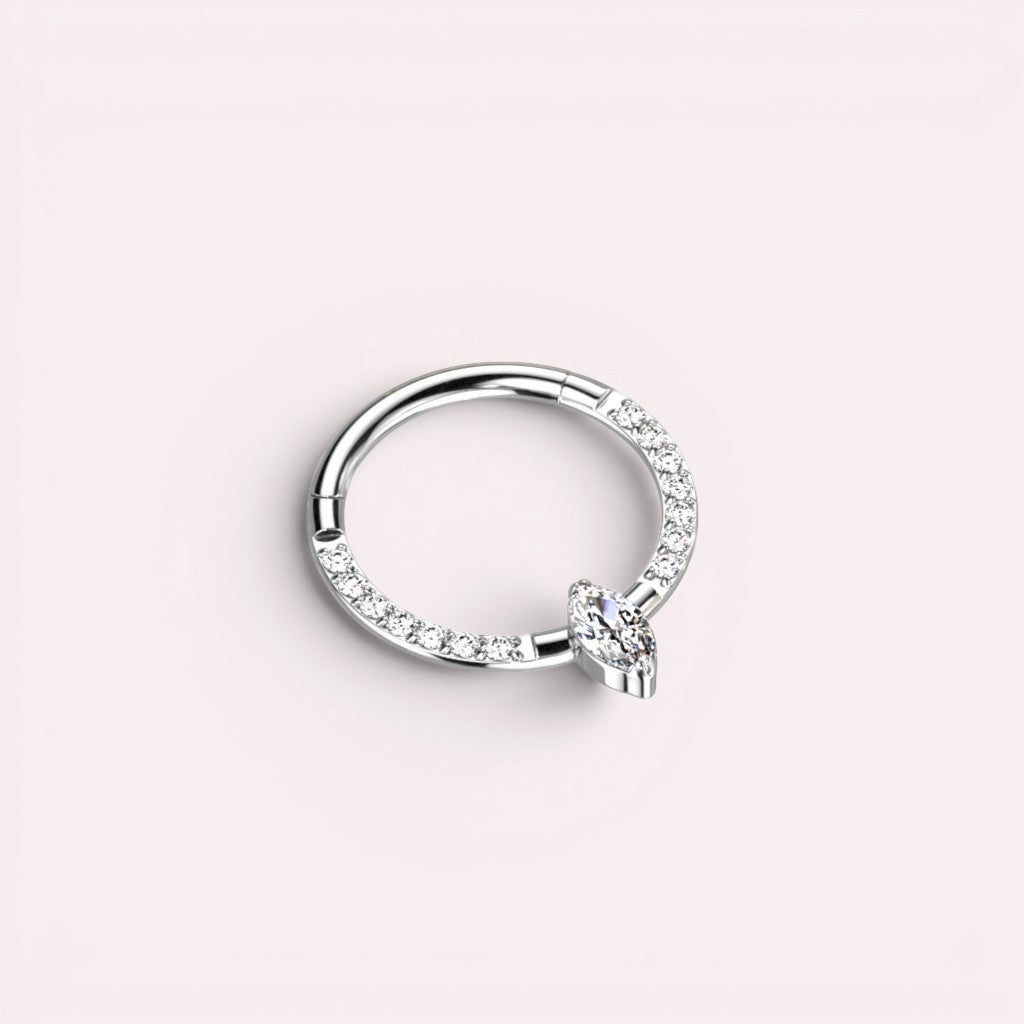 MKBodyJewelry 16g titanium septum clicker ring featuring a marquise cut center gem and pavé stones in silver tone.