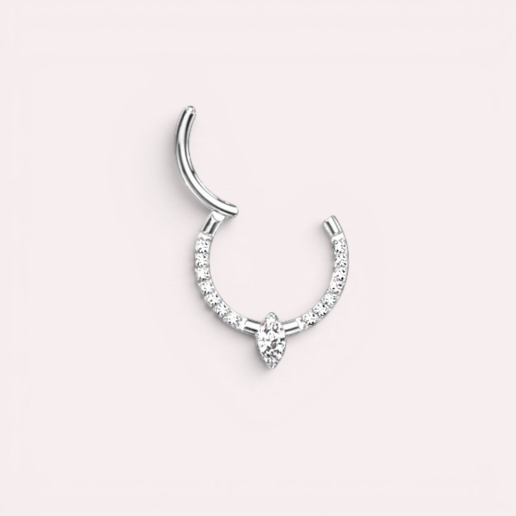 MKBodyJewelry 16g titanium septum clicker ring with a marquise cut center gem and pavé accents in silver.