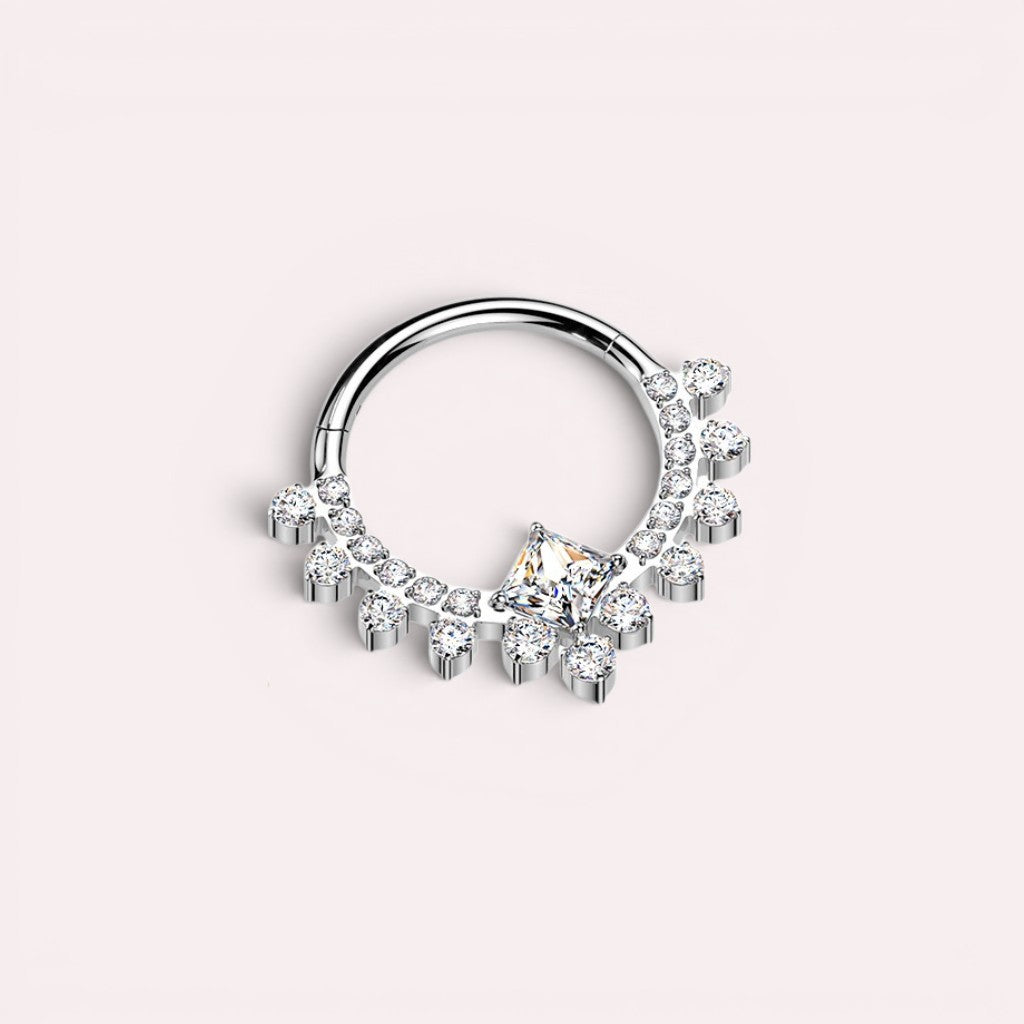 MKBodyJewelry silver titanium septum clicker ring with sparkling CZ crystals and a central square-cut stone.