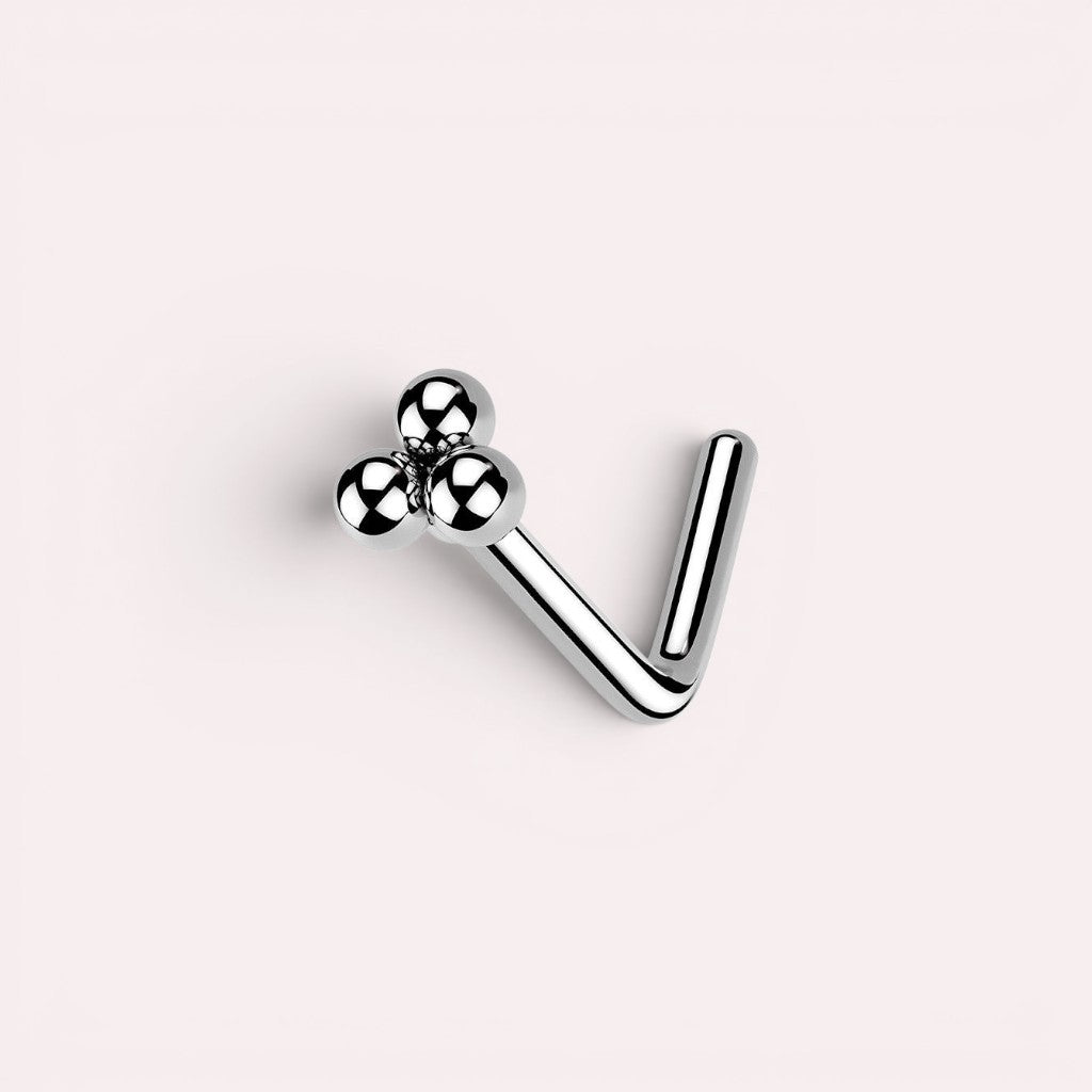 MKBodyJewelry silver L-shaped nose stud featuring a minimalist cluster of three polished spheres for a chic look.